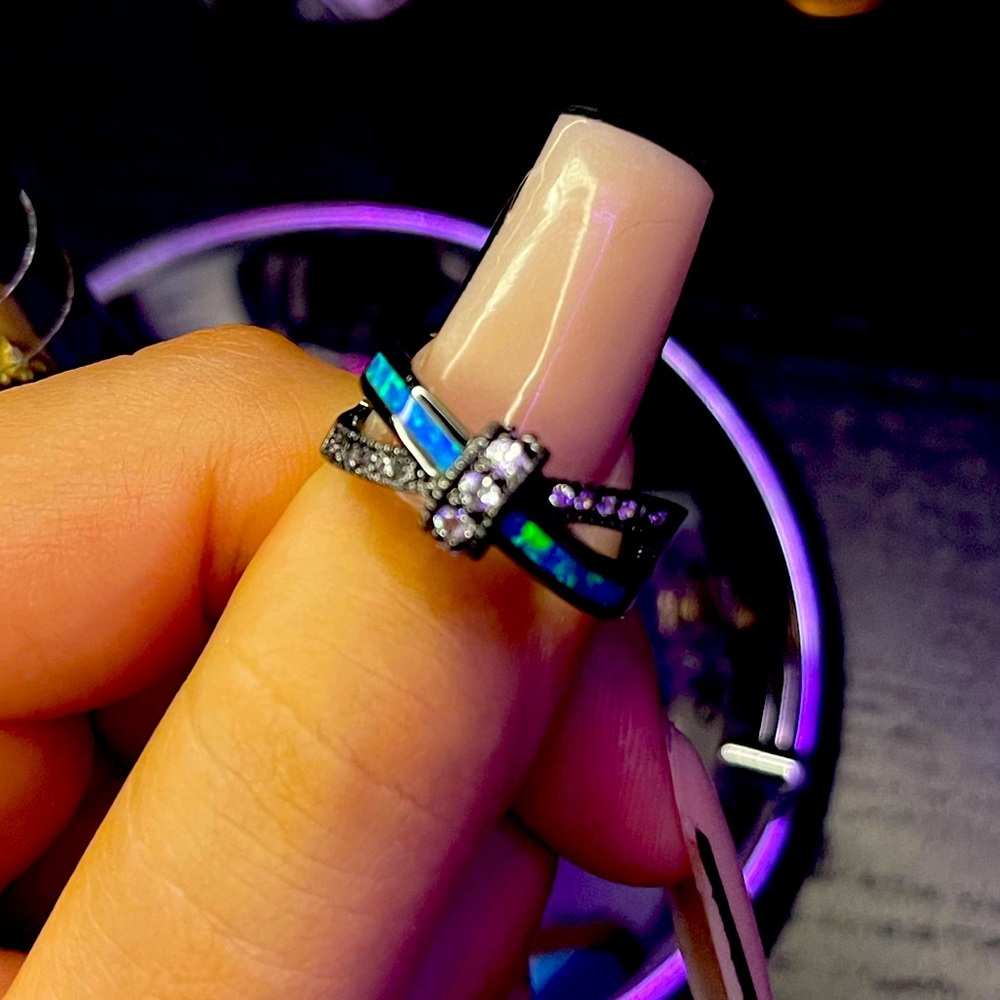 Black diamond blue topaz ring